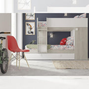 Bedroom with bunk bed and pull-out bed with integrated wardrobe in worn white and reversible white