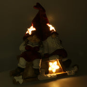 Resin LED Santa Claus with red child cm40x26h15