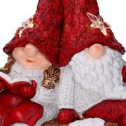 Resin LED Santa Claus with red child cm40x26h15