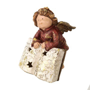 Resin angel with gold book cm17x15,5h22,5