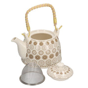 White ceramic teapot with cream decorations cmø15h16
