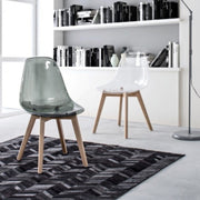 Easy smoked polycarbonate design chair with wooden feet