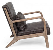 Faux leather armchair with vintage style cushion