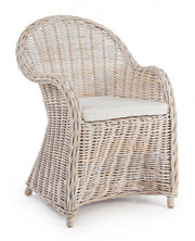 Armchair with new white cushion in natural fibers