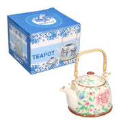 White ceramic teapot with flowers cmø15h18
