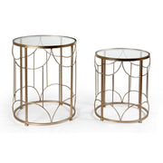 Set of two round gold coffee tables with glass top
