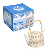 White ceramic teapot with cream decorations cmø15h16