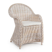 Armchair with new white cushion in natural fibers