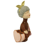 Resin woman with brown flower bag cm17x13h35