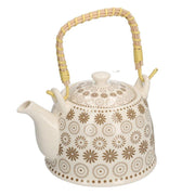 White ceramic teapot with cream decorations cmø15h16